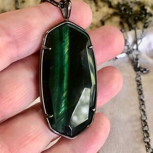 Kendra Scott gunmetal framed Reid necklace in green tigers eye.